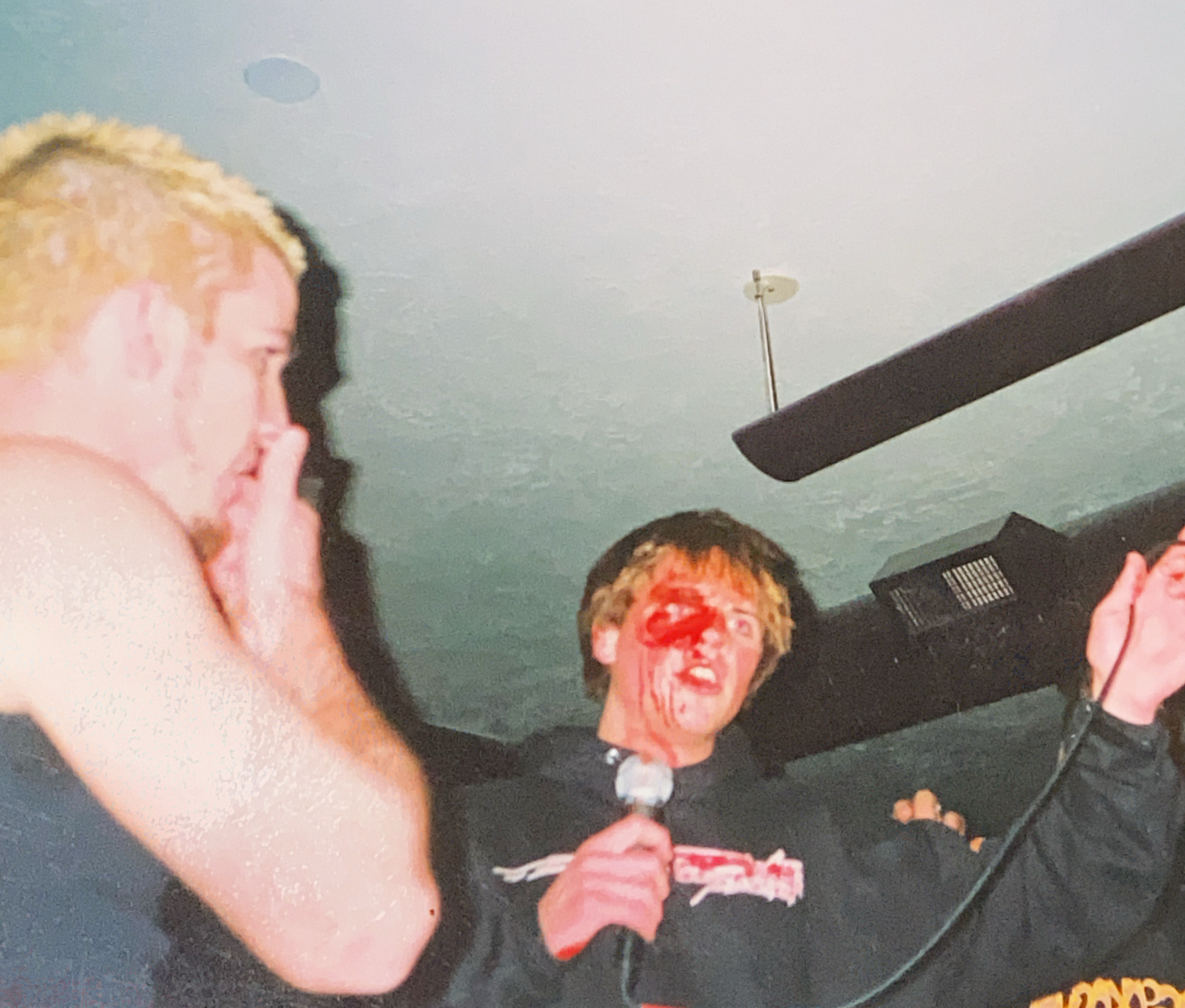 Jonathan Taylor performing onstage with bandmates